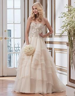 Soutache lace and tulle ball gown complemented with a sabrina neckline.