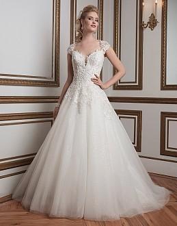 Beaded lace and tulle, ball gown complemented with a queen anne neckline.