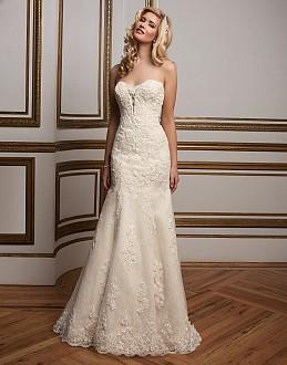 A plunging sweetheart neckline with floating beaded lace appliques is a focal po