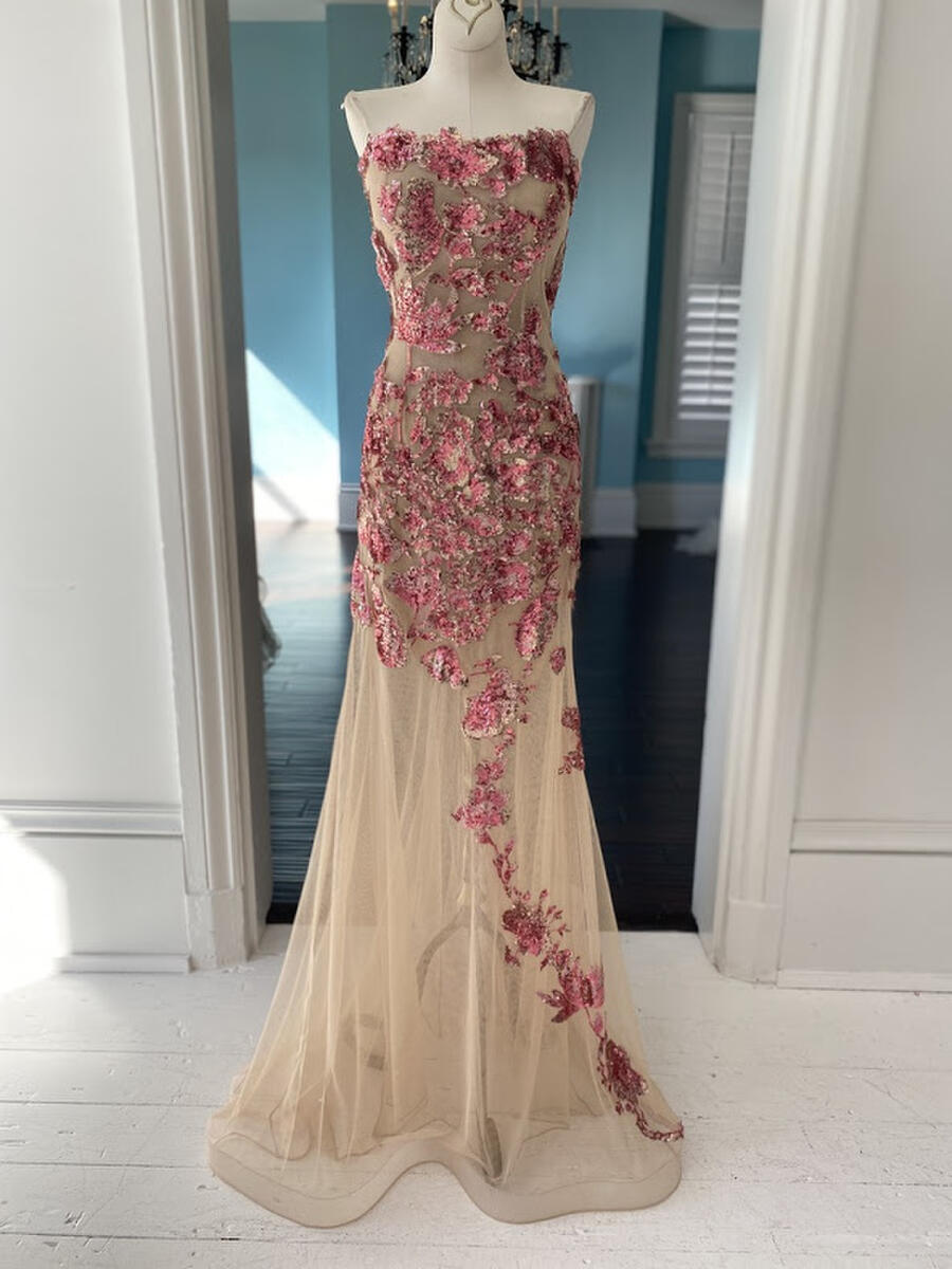 Juan Carlos Pinera nude fitted bustier gown with coral sequin floral applique