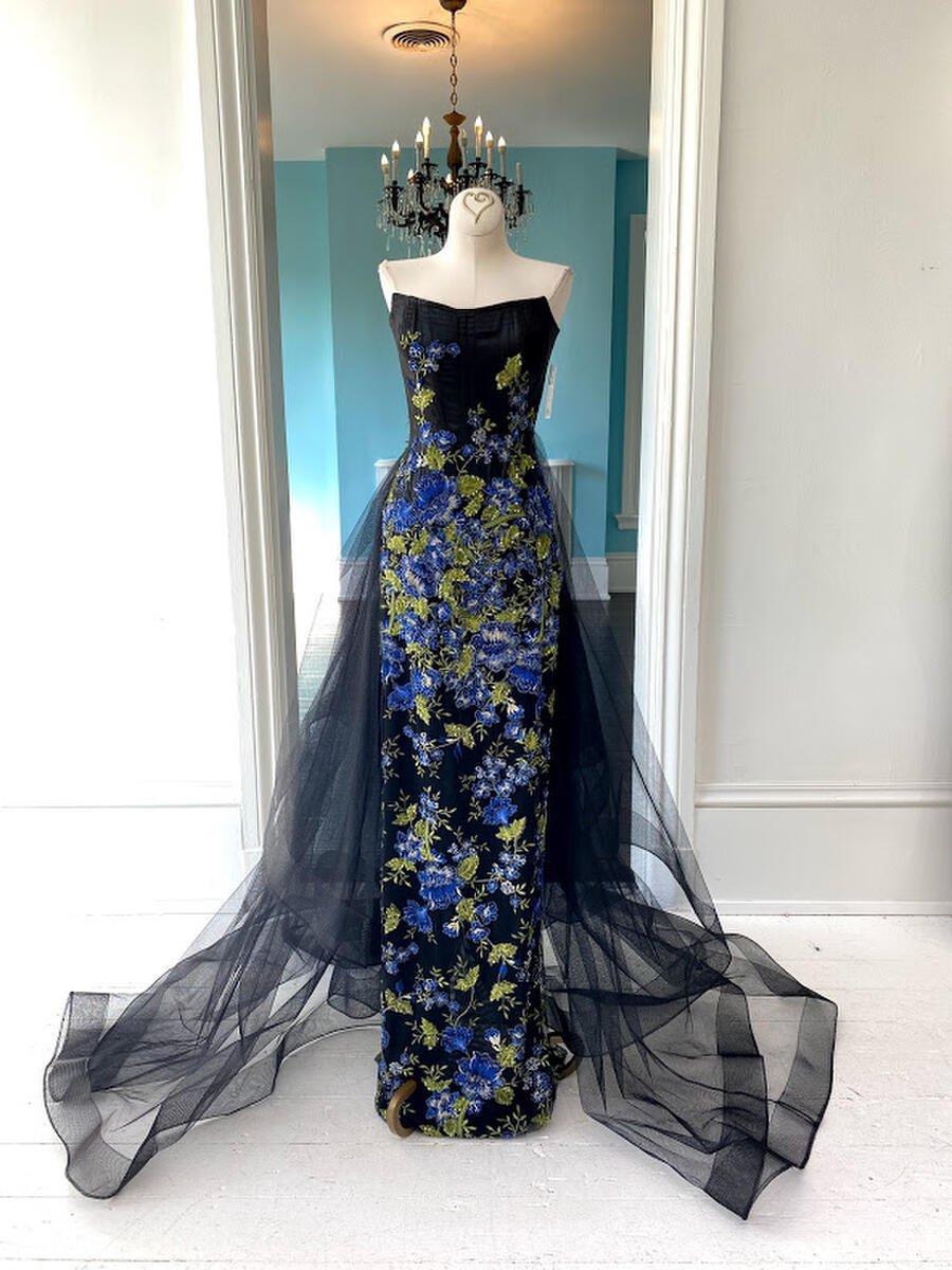 Juan Carlos Pinera straight black gown with blue floral applique